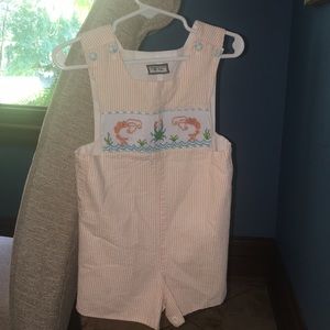orange and white striped smocked outfit.
